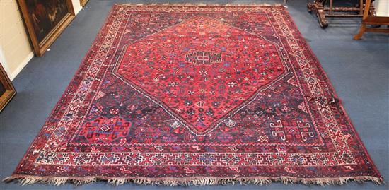 Shiraz red ground carpet, 10ft by 7ft 5in.(-)